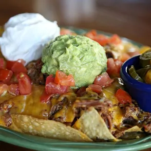 a plate of nachos and guacamole