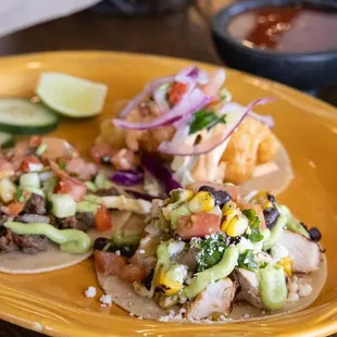 a plate of tacos and chips