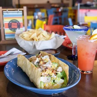 a plate of food and a drink on a table