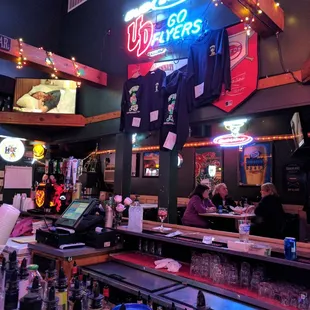 a bar with a neon sign