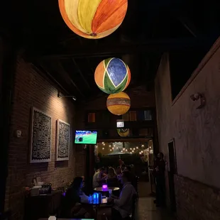 people sitting at tables in a restaurant