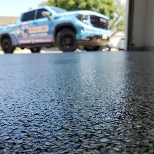 Close up of Tuxedo 14&quot; Epoxy Flakes in Garage