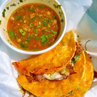 a bowl of soup and a plate of quesadillas