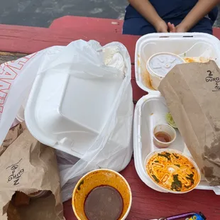 a woman sitting at a picnic table