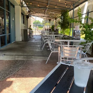 Outdoor seating area under shade. They also have heaters for those chilly days/nights.