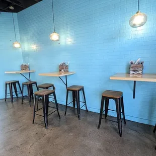 Love the turquoise wall and seating options