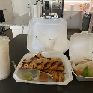 a meal in a styrofoam container