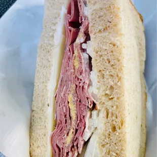Half of my pastrami on wheat bread