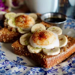 French toasts with eggs banana on top.