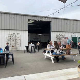 people sitting at tables outside