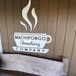 a cup of coffee on a bench