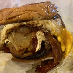 Egg burger with grilled onions and bacon