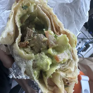 This burrito barely had any meat ! Just messed it up and tossed in bunch of cheap avocado sauce