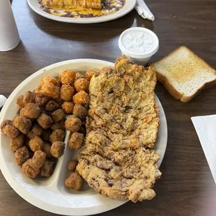 Chicken Fried Steak with Fried Okra and Tater tots and chili cheese burrito