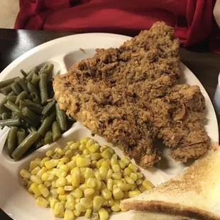 Chicken fried steak with corn and green bean sides