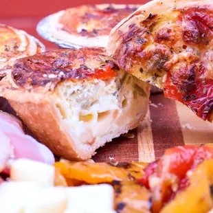 Handmade Quiche, ham and Swiss or Veggie with Roasted red pepper, artichoke and mozzarella