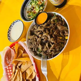 a bowl of chips and a bowl of salad