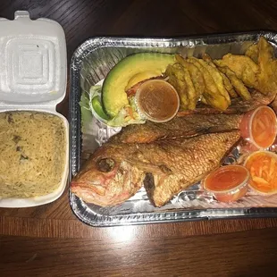 Fried red snapper, tostones, avocado and rice with beans