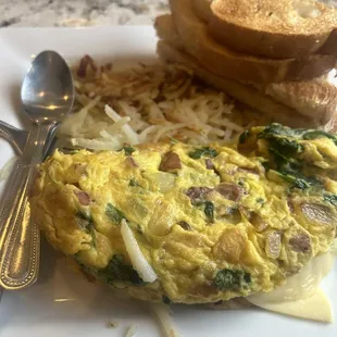 Corn beef omelette with light onions, spinach, hash browns and rye toast. And a mimosa. Mimosa was alright.