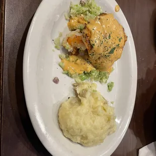 Double stacked blackened salmon with mashed potatoes as the side dish.