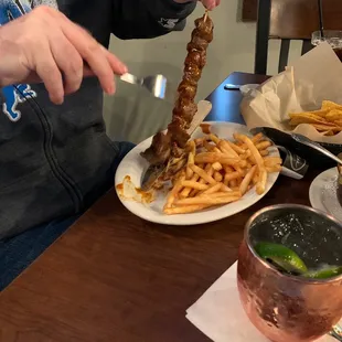 Steak tips and a large quantity of what looks like very crispy yummy fries