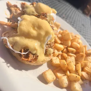 Pulled pork eggs Benedict and hashbrowns! /country potatoes :)