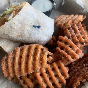 This was such an amazing spicy chicken wrap!!  The sweet potatoes waffle fries were delicious!