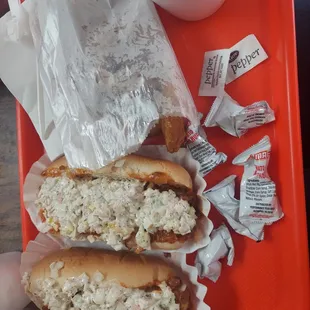 Slaw dogs with onion rings.