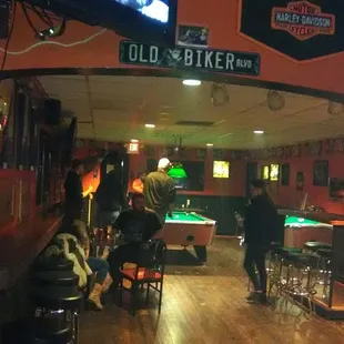 people playing pool in a bar