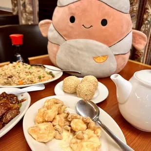 a plate of food and a stuffed animal