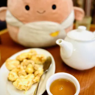 a plate of food and a cup of tea