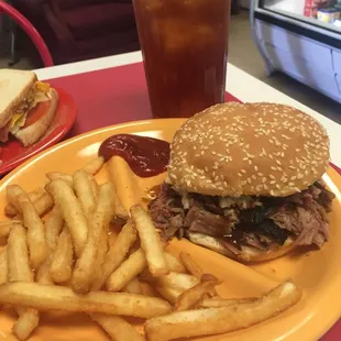 a hamburger and fries on a plate