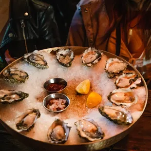 a platter of oysters on ice