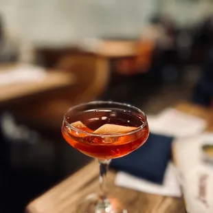 a glass of wine on a table