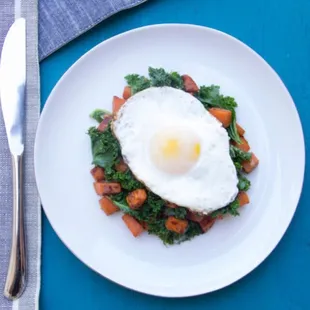 Sweet potato kale hash with sunny side egg.