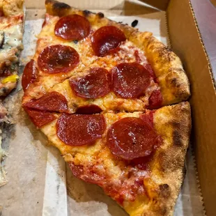 two slices of pepperoni pizza