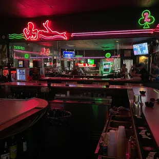 a bar with neon signs