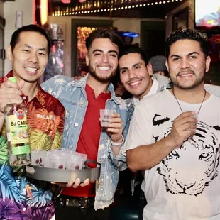 a group of men at a bar