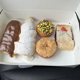 Custard-filled Long John, giant lady lock, toasted coconut, Steeler sprinkled cake donut, &amp; cherry strudel.