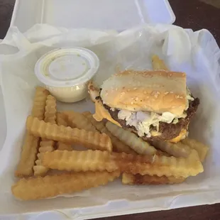 One half of the lotta burger with crinkle fries and one cup of the ranch