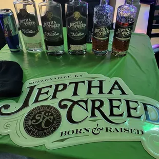 a table with bottles of spirits