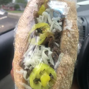 a sandwich wrapped in plastic