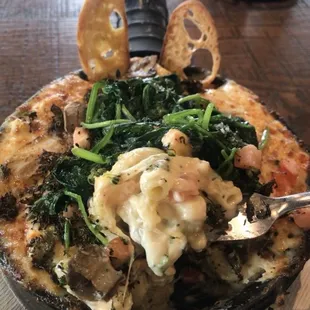 Cheese and lots of it inside and hot melted with plenty of onion and spinach and tomato and cheese of top