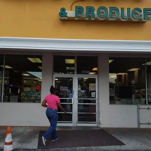 a woman walking out of a store