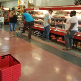people shopping in a grocery store
