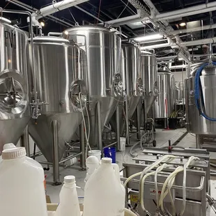 a row of tanks in a brewery