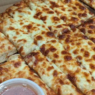 Cheesy Garlic Bread is just a must have with every order!