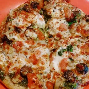 a pizza on an orange plate