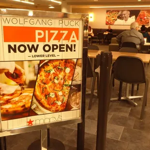 a pizza sign in a restaurant