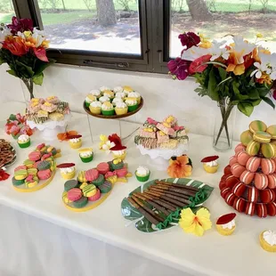 a table with a variety of desserts